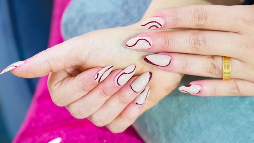 Pedicure and manicure with plastic nail extensions and normal color for hands 